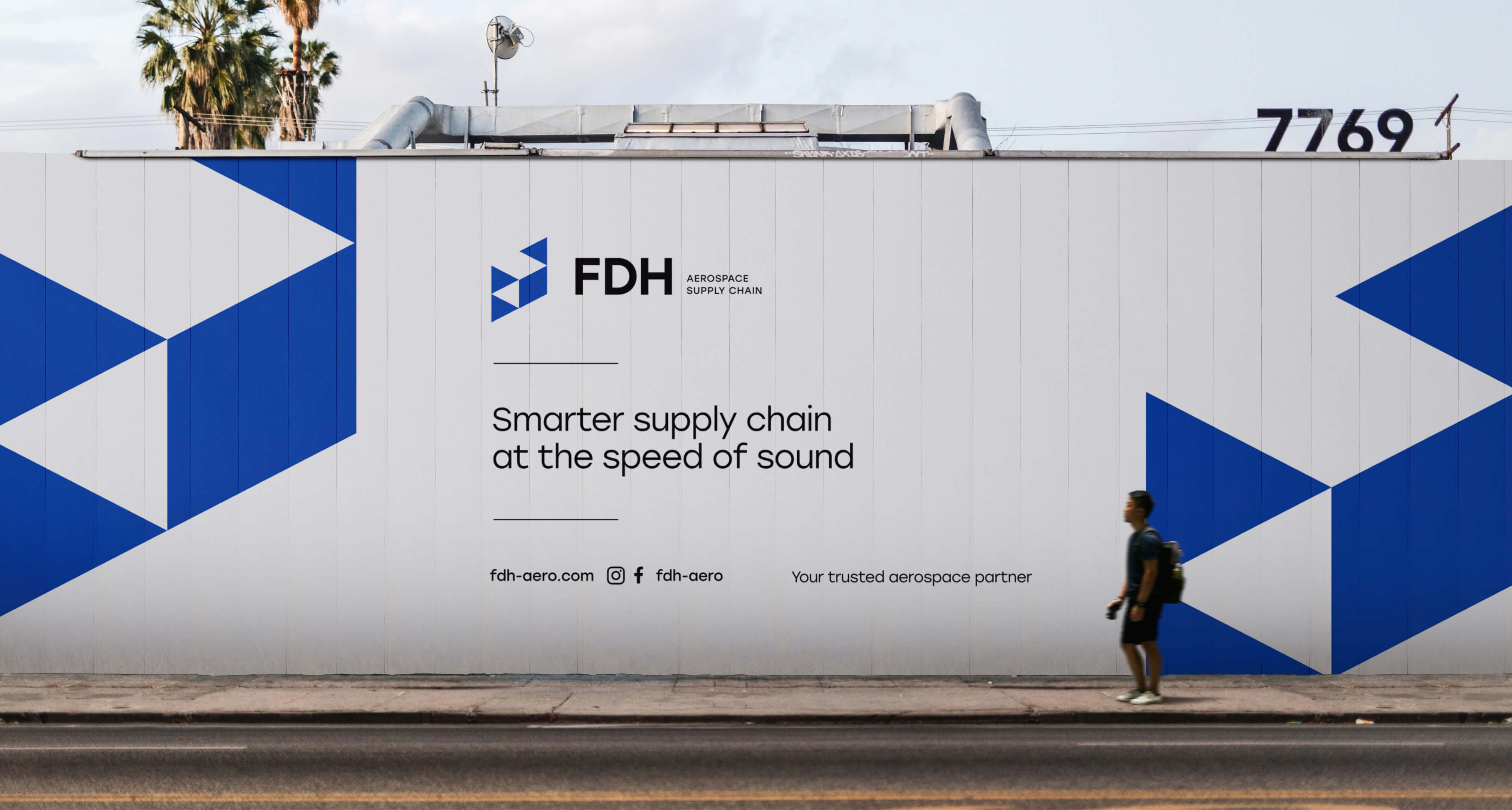 Street billboard with a passerby that reads: 'Smarter supply chain at the speed of sound.'